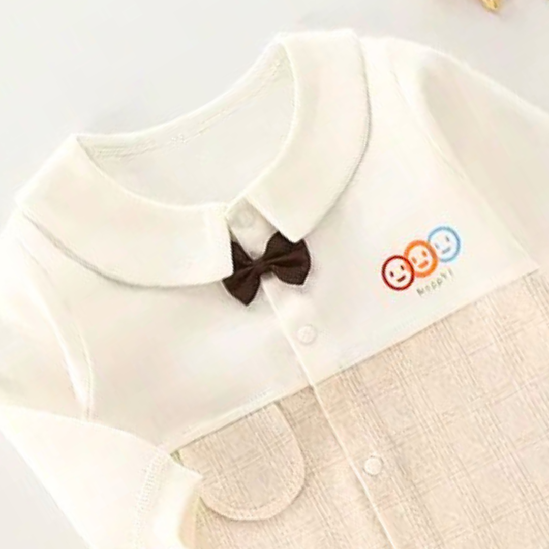 Ju Ju Jam Happy Snuggle Bow Romper – unisex baby romper with soft fabric and adorable bow detail.

