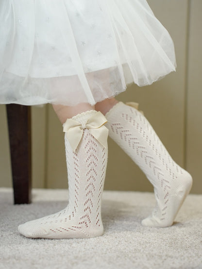 Comfortable lace socks with bow for infants – Ju Ju Jam fashionable baby girls’ accessories.

