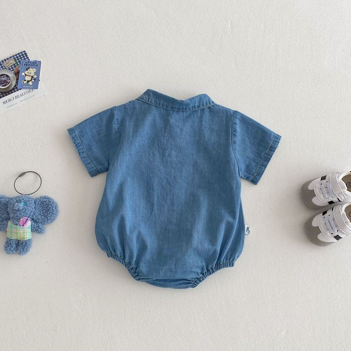 Laid flat Lil' Denim Romper – sleeveless baby romper in light-wash denim

