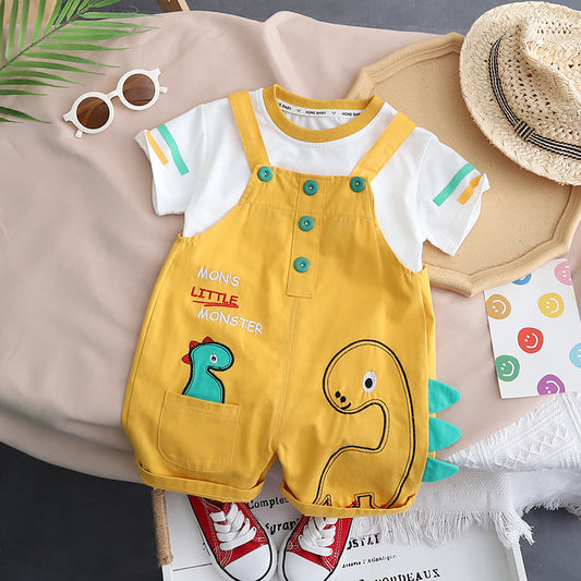 Adorable baby wearing a Little Dino Monster-themed jumpsuit from Ju Ju Jam.