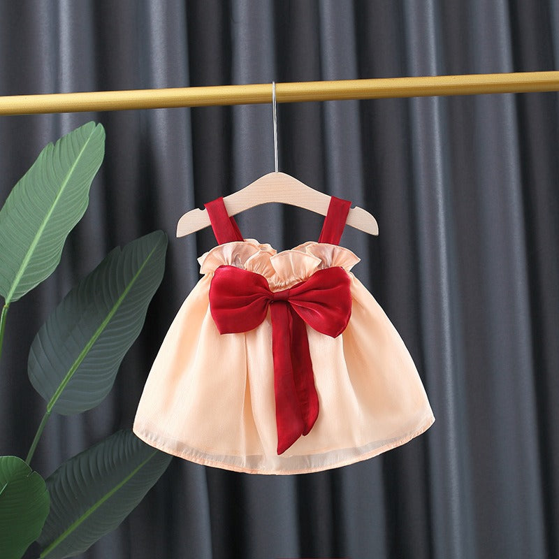 Baby girl wearing Ju Ju Jam's Melody Bow Party Dress – perfect for festive occasions

