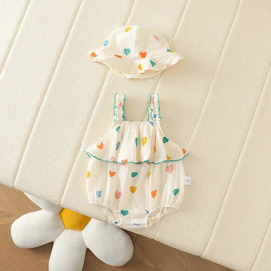 Adorable baby girls romper with tiny heart prints and matching hat – soft cotton one-piece by Ju Ju Jam.

