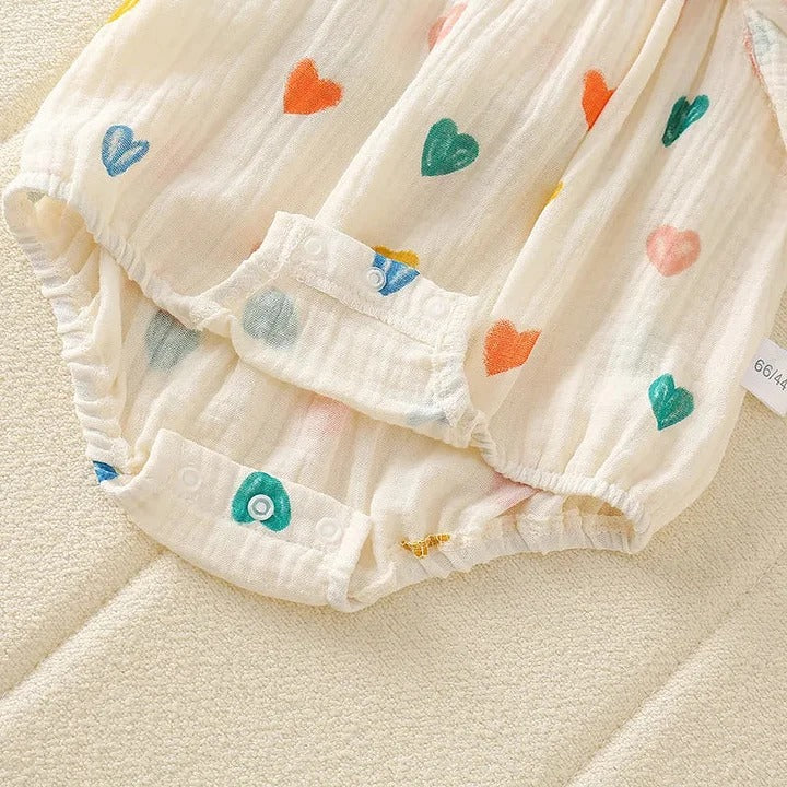 Mini Hearts romper for baby girls with coordinating hat – lightweight and stylish summer outfit from Ju Ju Jam.

