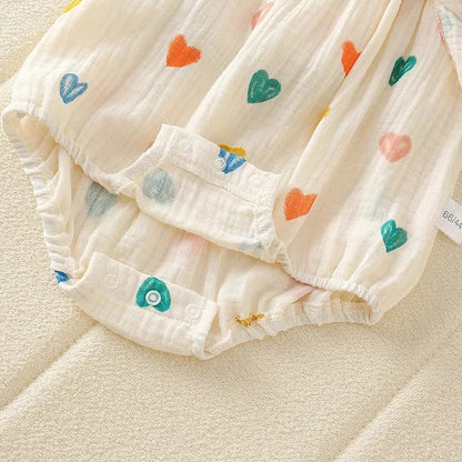 Mini Hearts romper for baby girls with coordinating hat – lightweight and stylish summer outfit from Ju Ju Jam.

