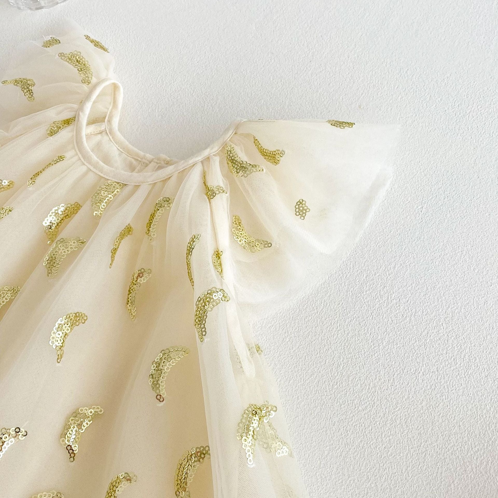 Laid flat Nyla Party Princess Baby Dress – glamorous baby outfit with princess vibes

