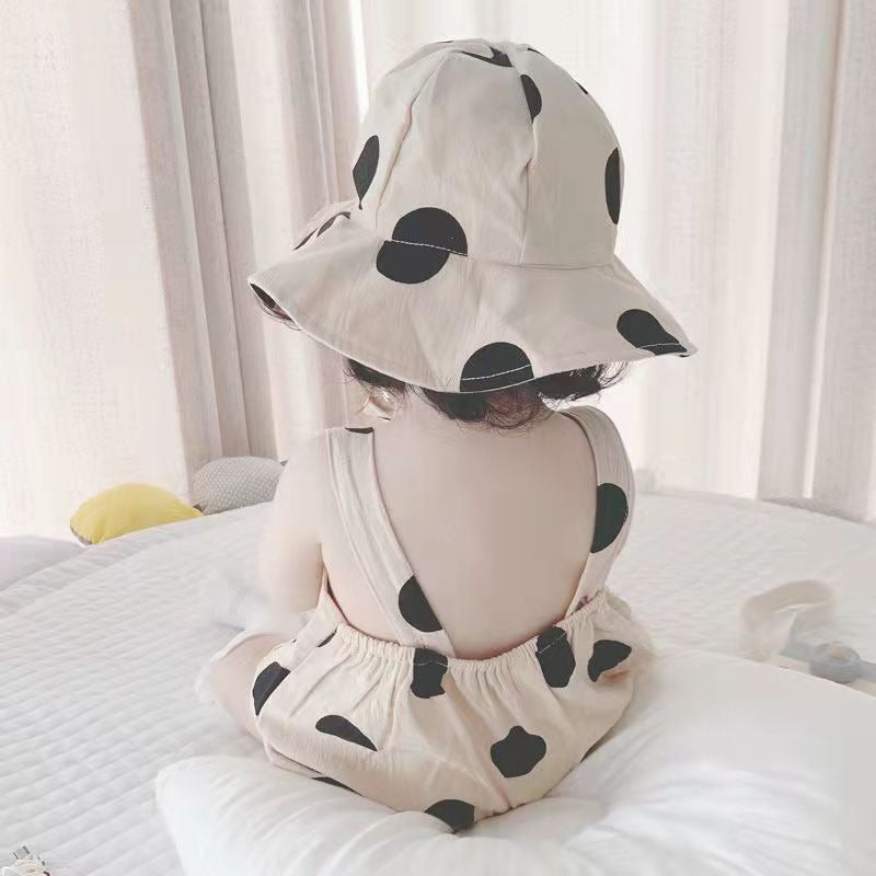 Close-up of Polka Pop baby jumpsuit fabric and matching hat – Ju Ju Jam

