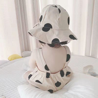 Close-up of Polka Pop baby jumpsuit fabric and matching hat – Ju Ju Jam

