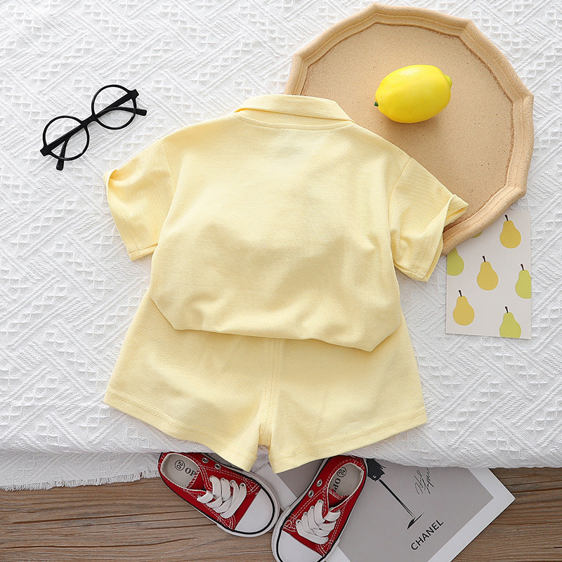 Pastel-colored baby girl outfit by Ju Ju Jam, including a co-ord set with a top and pants adorned with 3D flower embellishments.