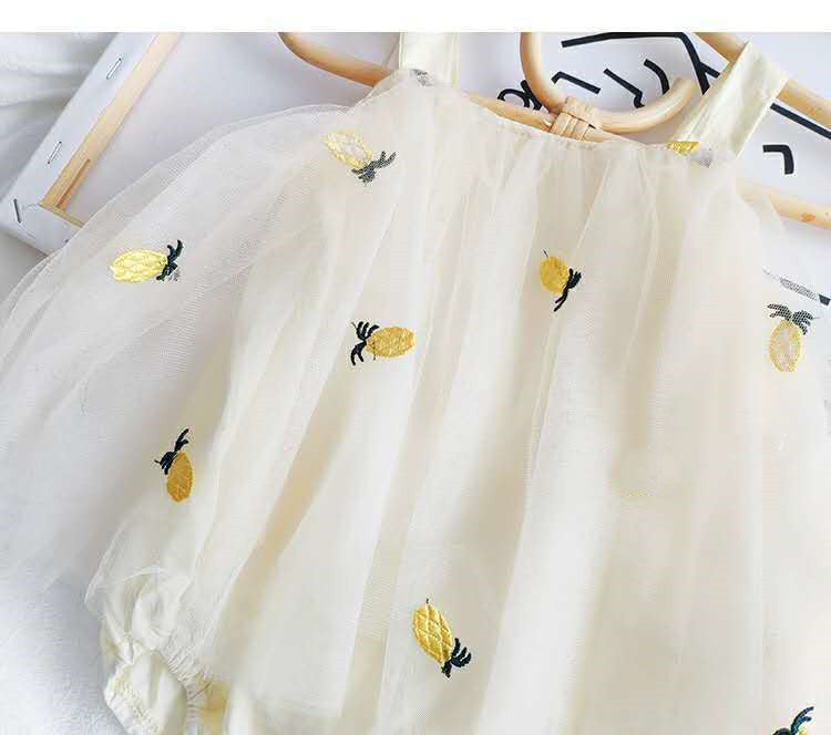 Sweet baby girl in a Pineapple Frill romper dress, perfect for summer from Ju Ju Jam