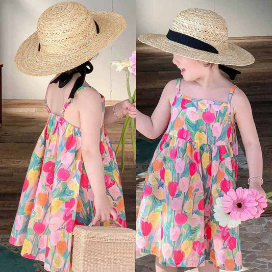 Pink Floral Vacation Girls Dress - Bright and playful dress with a pink floral print, perfect for vacation and summer outings, available at Ju Ju Jam.