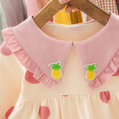 Girls' pink dress with polka dots and pineapple print from Ju Ju Jam