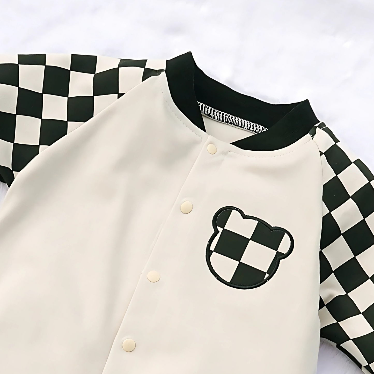 Baby boy or girl in Ju Ju Jam plaid sleeve romper – soft fabric with classic pattern

