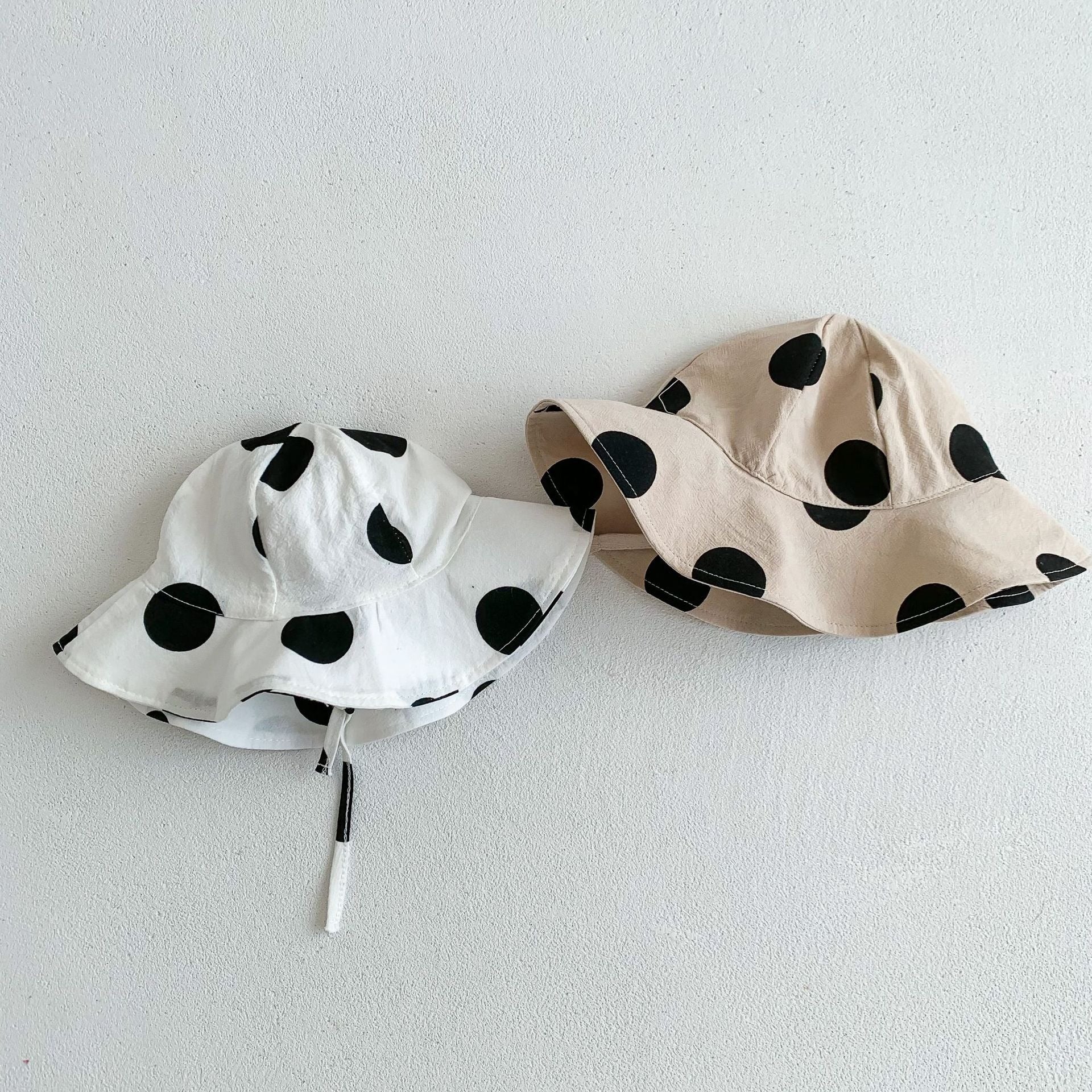 Front view of baby wearing Polka Pop jumpsuit and hat – Ju Ju Jam

