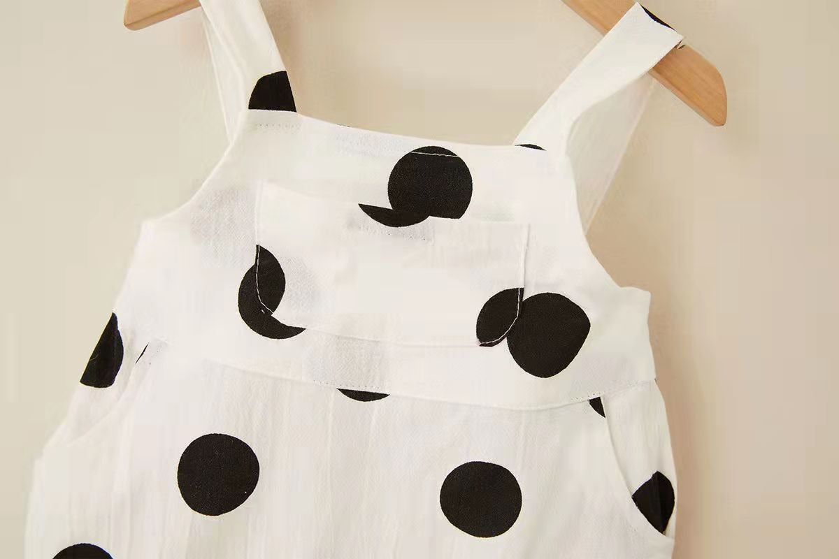 Smiling baby in unisex polka dot jumpsuit and cap – Ju Ju Jam

