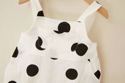 Smiling baby in unisex polka dot jumpsuit and cap – Ju Ju Jam

