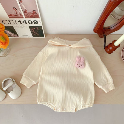 Snuggly bunny romper with hood and tail – gender-neutral onesie by Ju Ju Jam for babies.

