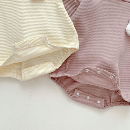 Ju Ju Jam unisex baby onesie – rabbit hood and fluffy tail design for extra cuteness and comfort.

