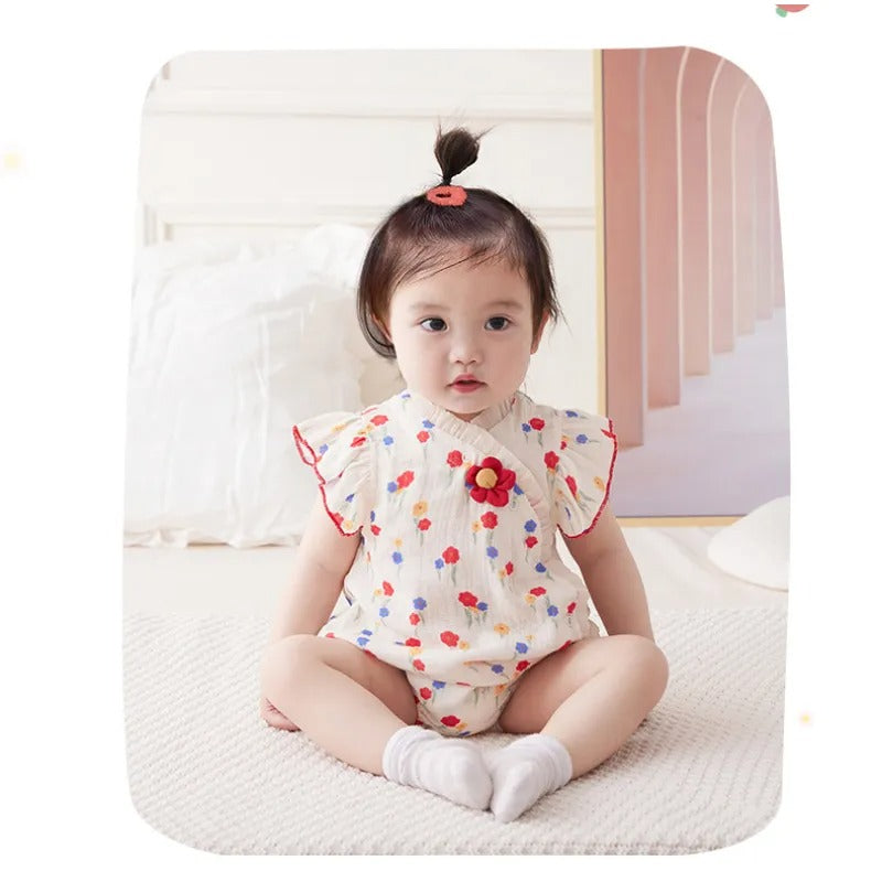 Sweet baby girl dressed in a Red Flower Attached romper, perfect for any occasion from Ju Ju Jam.