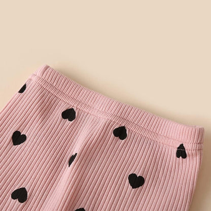 Ju Ju Jam's baby girls romper and pant set with ruffle sleeves and head bow, offering both comfort and elegance for any occasion.