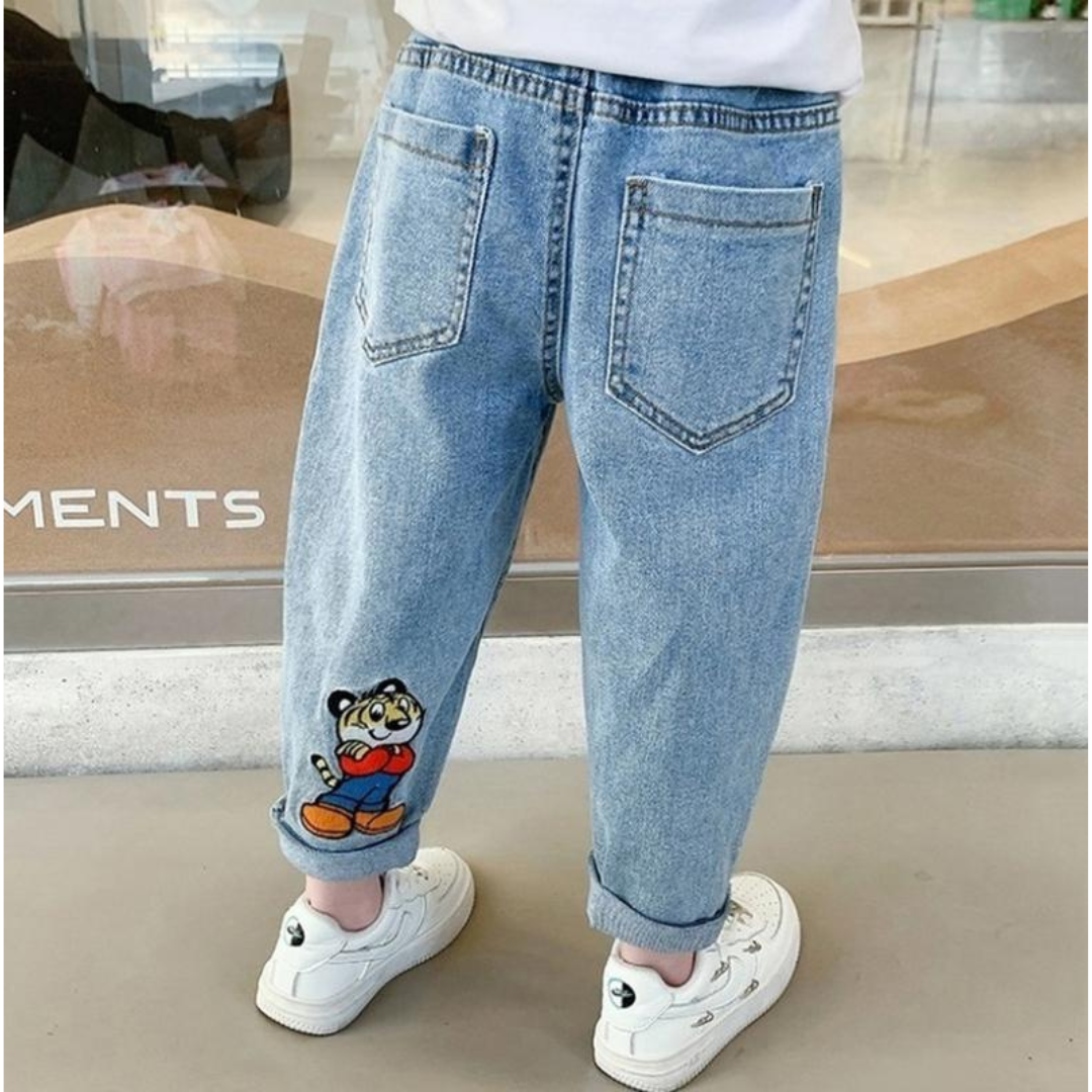 Stylish boy in Ju Ju Jam Tiger Swag Denim Jeans with bold tiger print

