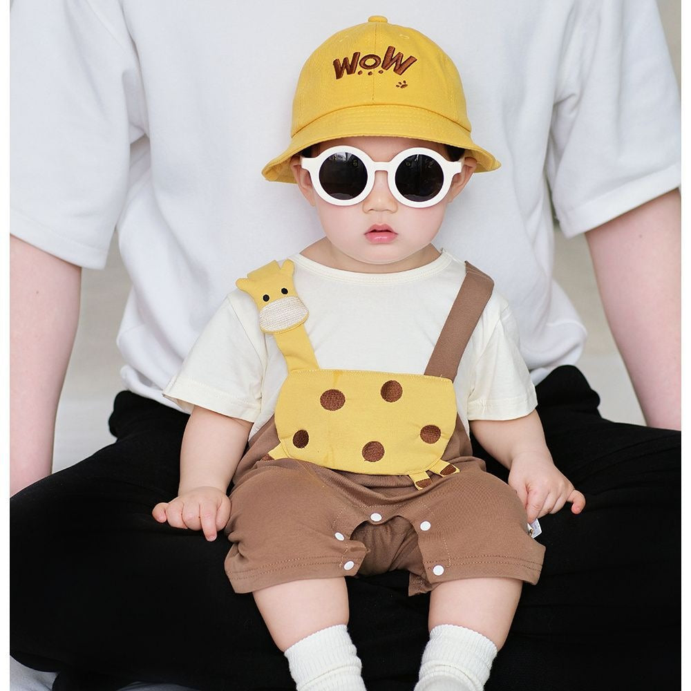 Baby in Tiny Sunny Safari Jumpsuit by Ju Ju Jam – cheerful safari-themed baby outfit

