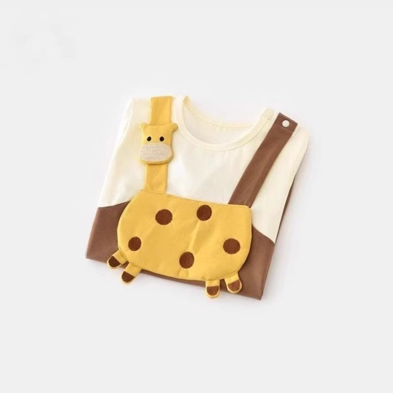 Close-up of Tiny Sunny Safari Jumpsuit – soft cotton fabric with safari illustrations

