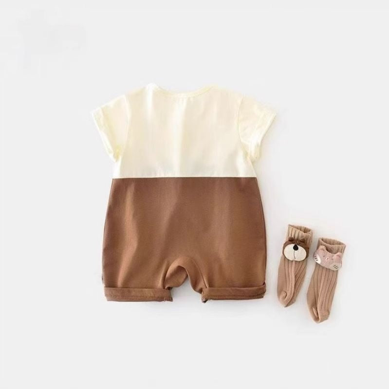 Happy infant wearing Tiny Sunny Safari Jumpsuit – perfect for summer adventures

