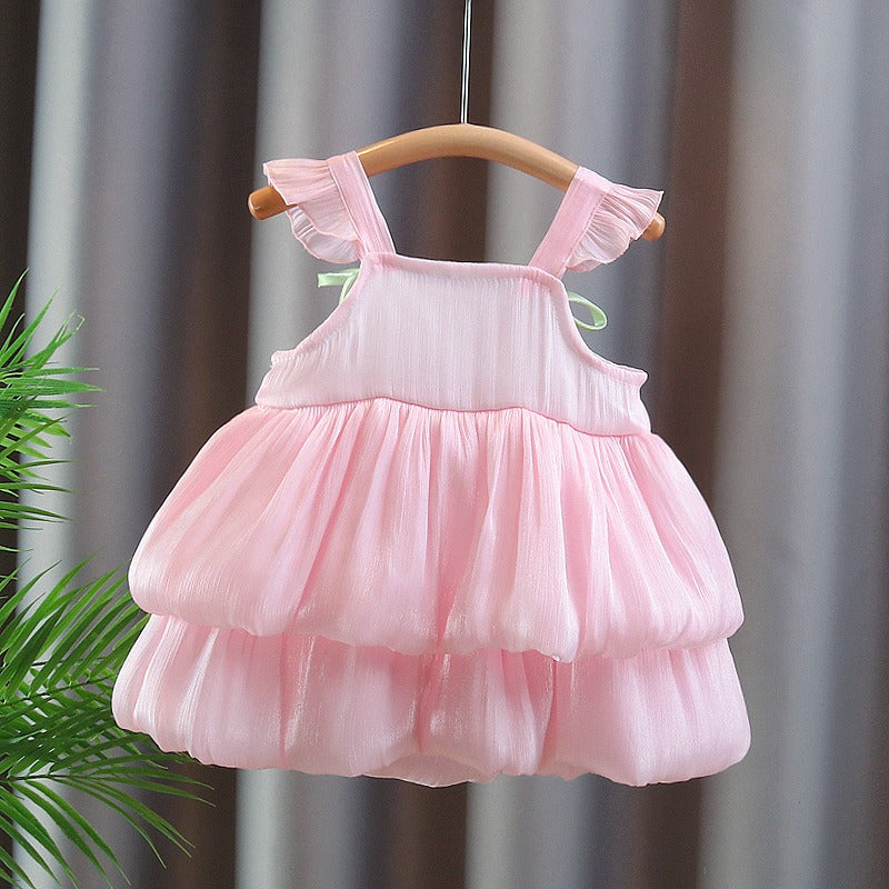 Close-up of layered design and tulip accents on girls dress by Ju Ju Jam

