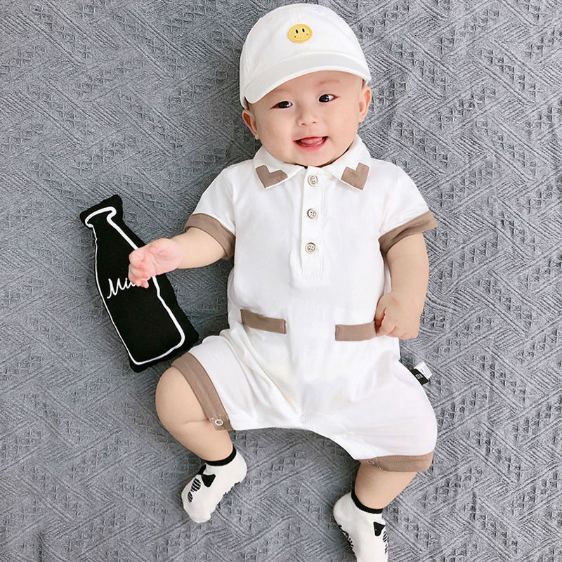 Baby boy in a White Collared romper from Ju Ju Jam.