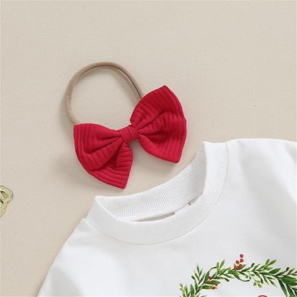 Flat-lay of Baby Girls Merry Christmas Top with Bell Bottom Set, highlighting its vibrant holiday colors and soft fabric.