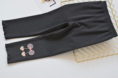 Ju Ju Jam's Princess Dark Bow Tights for girls, combining comfort with a sophisticated bow accent.