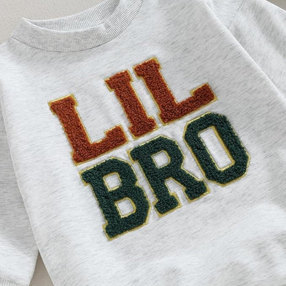 Ju Ju Jam Lil Bro Vibes Baby Boys Sweatshirt Romper – Soft and stylish, this romper features a cozy sweatshirt feel and a fun 'Lil Bro' print.